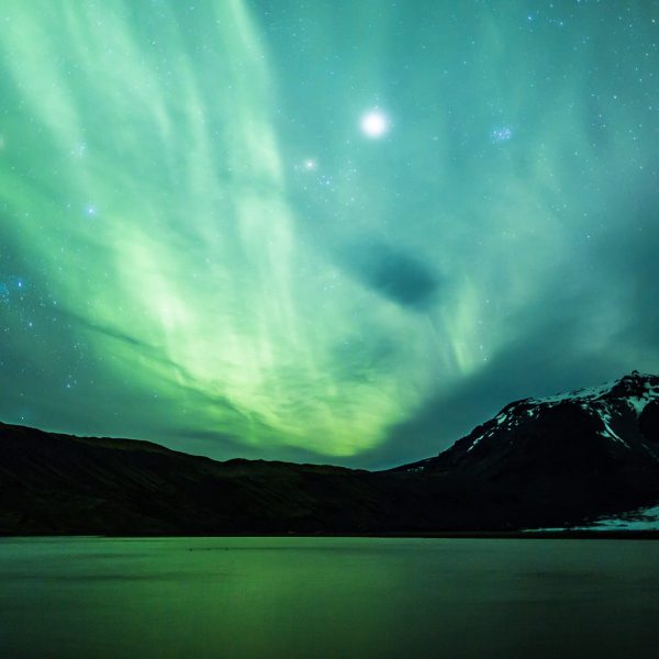 Aurora Borealis over a glacier lagoon in Iceland