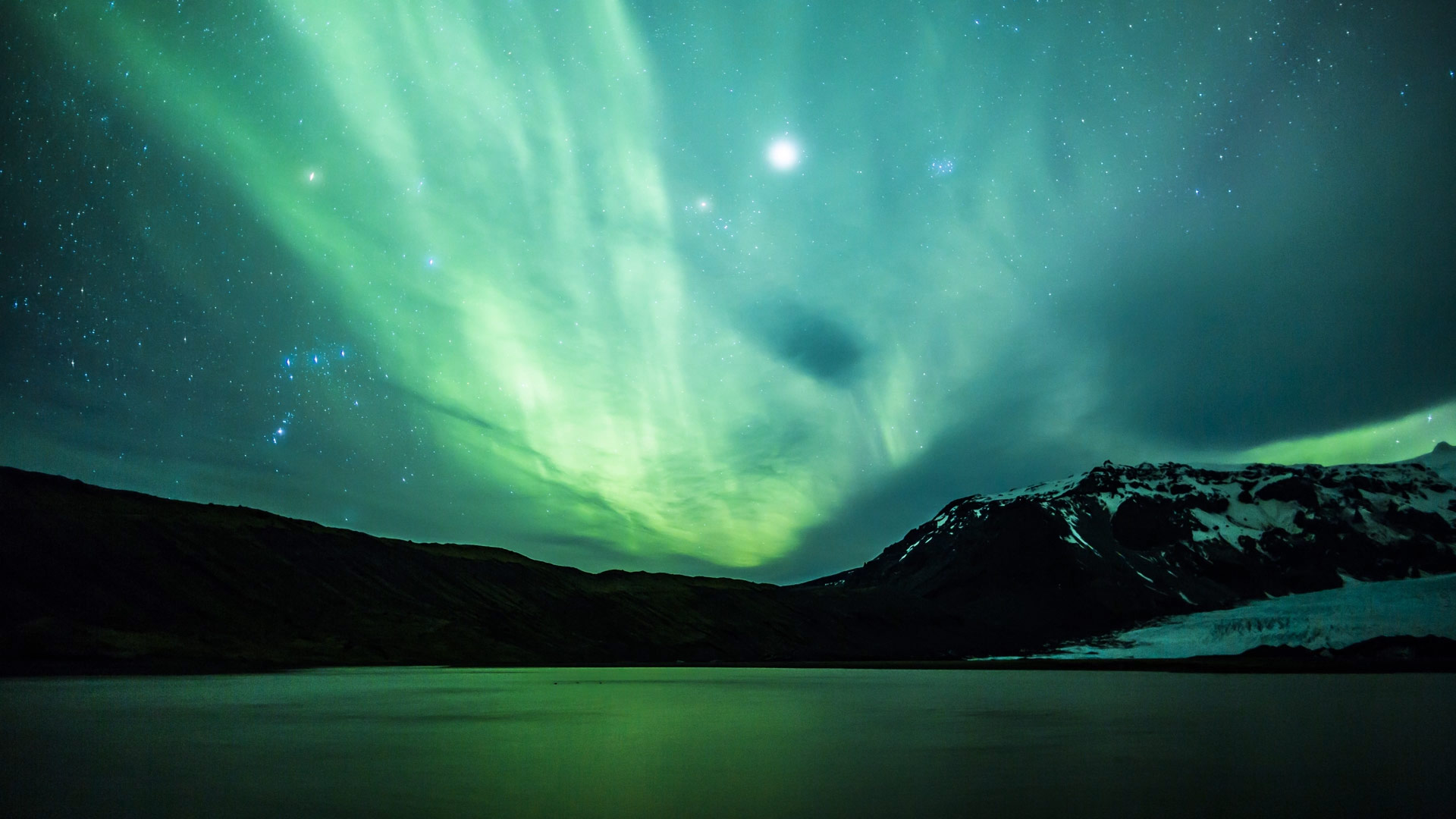 Aurora Borealis over a glacier lagoon in Iceland